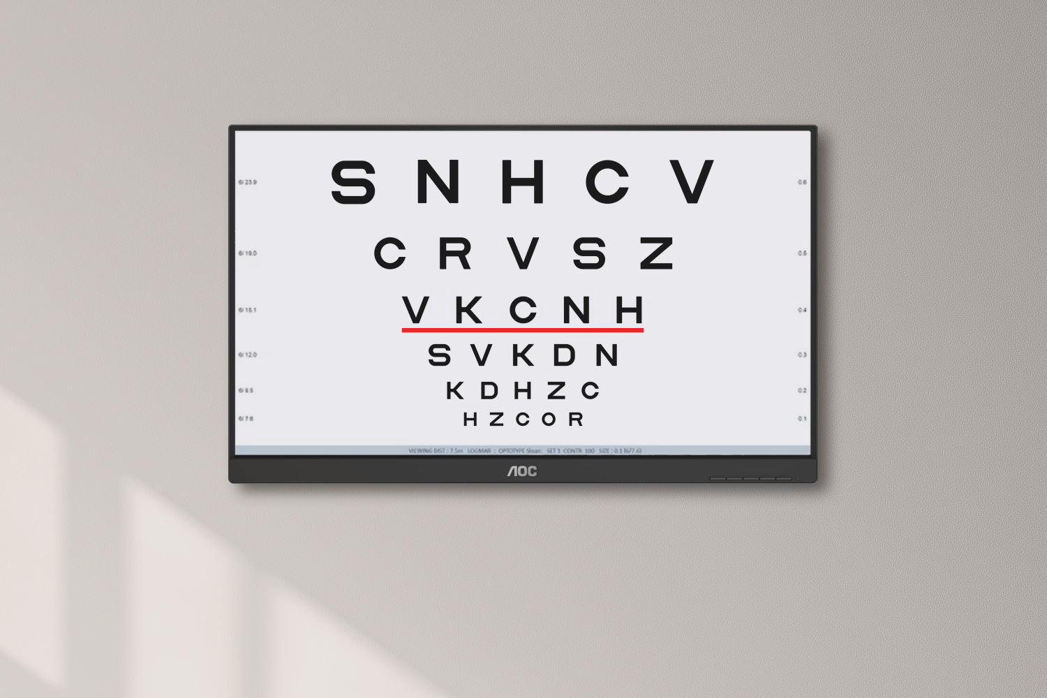 Thomson eye chart on a monitor on a white wall